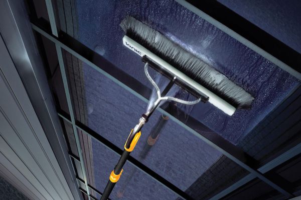 water fed pole cleaing outside a upstairs window