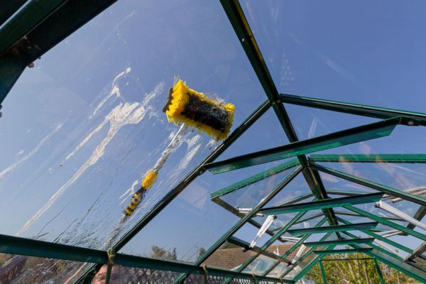 water fed pole cleaing outside a upstairs window